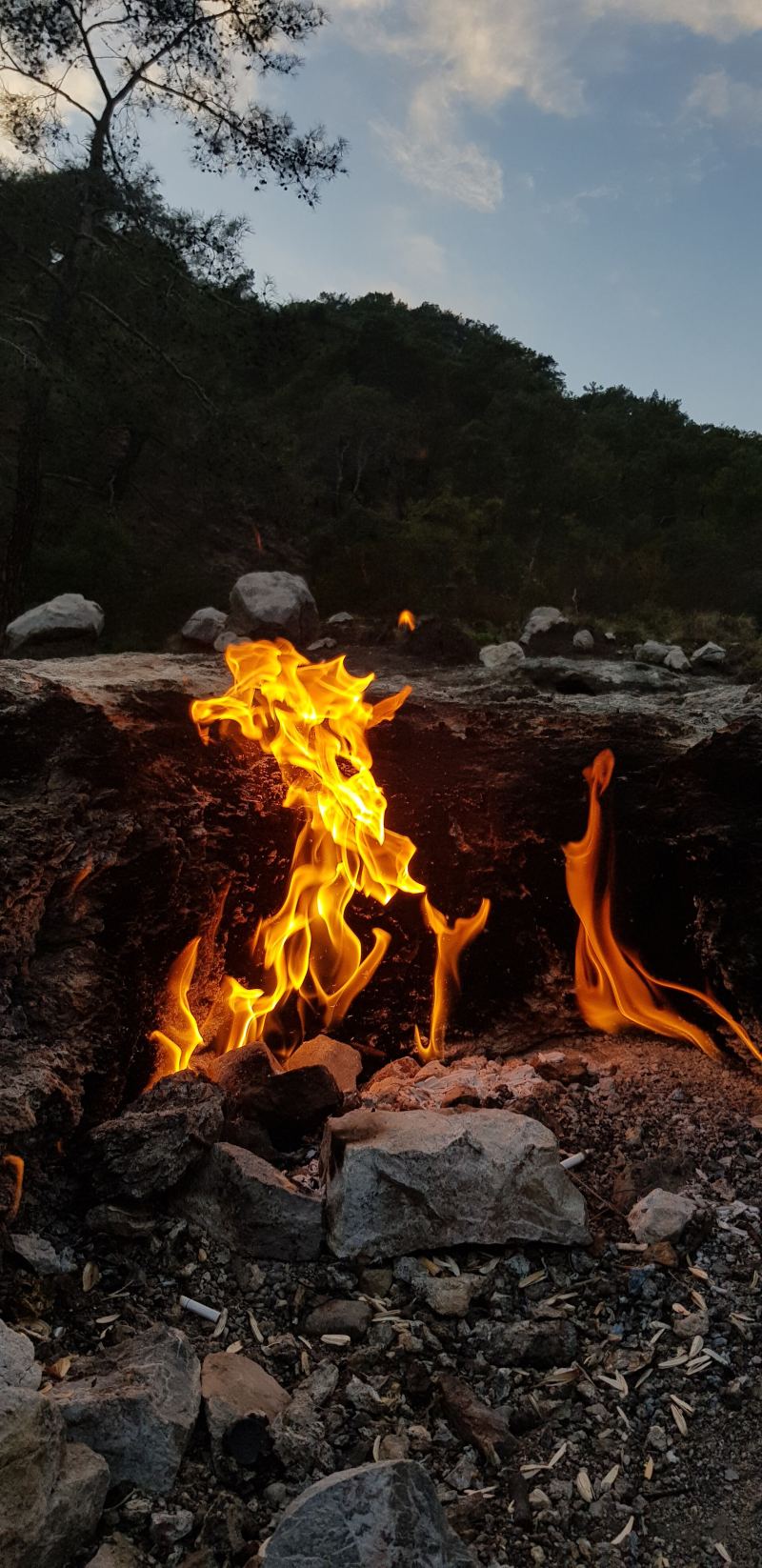 Small natural flames burning among rocks at Yanartaş