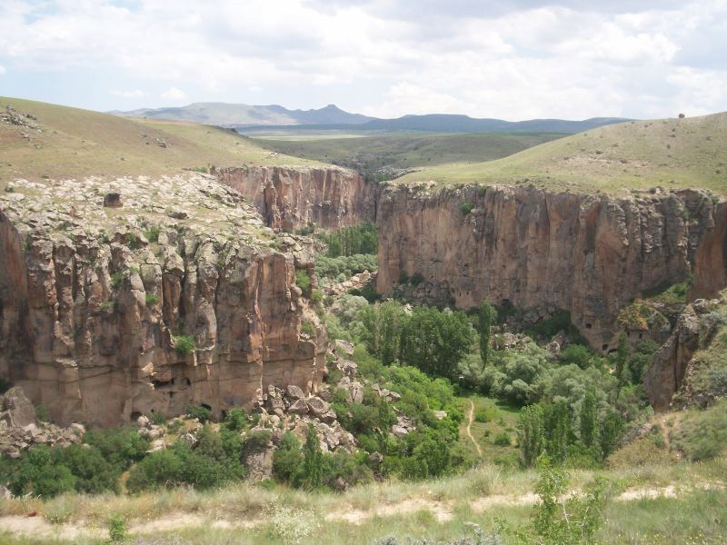 The green Ihlara Valley with the Melendiz stream between cliffs